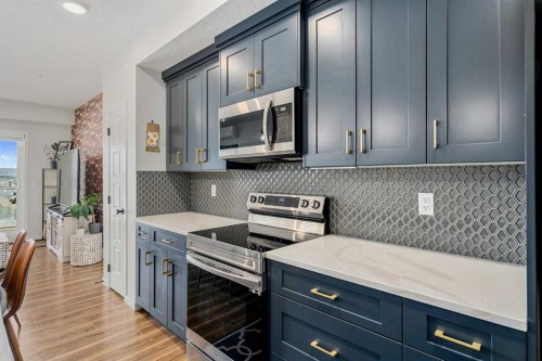 1306-42 Cranbrook Gardens Se, Calgary, AB - Indoor Photo Showing Kitchen With Upgraded Kitchen