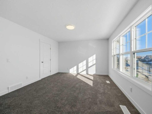 105 Creekstone Manor Sw, Calgary, AB - Indoor Photo Showing Other Room