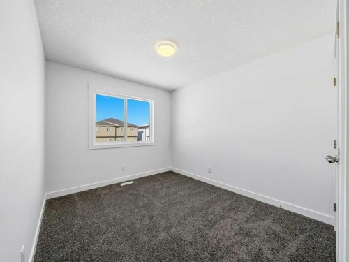 105 Creekstone Manor Sw, Calgary, AB - Indoor Photo Showing Other Room