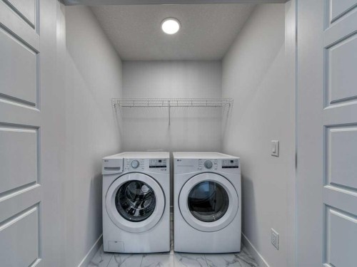 105 Creekstone Manor Sw, Calgary, AB - Indoor Photo Showing Laundry Room