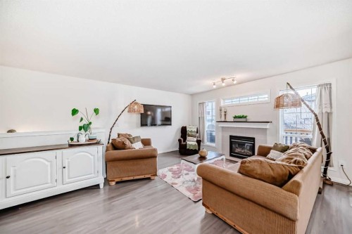 69 Canals Circle Sw, Airdrie, AB - Indoor Photo Showing Living Room With Fireplace