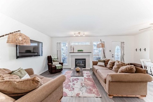 69 Canals Circle Sw, Airdrie, AB - Indoor Photo Showing Living Room With Fireplace