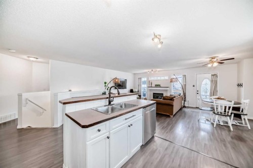 69 Canals Circle Sw, Airdrie, AB - Indoor Photo Showing Kitchen With Double Sink