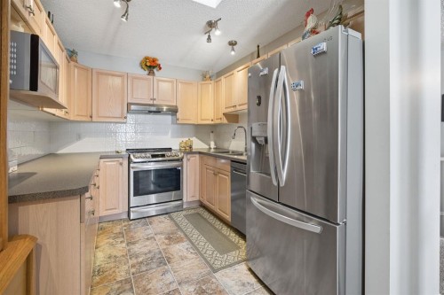 216 Valley Ridge Heights Nw, Calgary, AB - Indoor Photo Showing Kitchen With Stainless Steel Kitchen With Double Sink