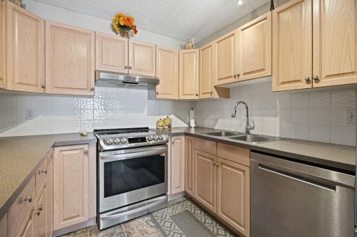 216 Valley Ridge Heights Nw, Calgary, AB - Indoor Photo Showing Kitchen With Double Sink