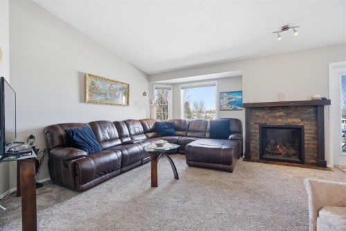 216 Valley Ridge Heights Nw, Calgary, AB - Indoor Photo Showing Living Room With Fireplace