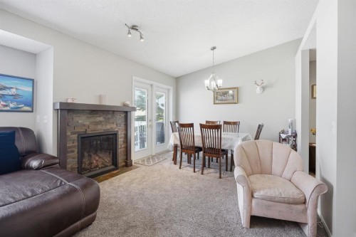 216 Valley Ridge Heights Nw, Calgary, AB - Indoor Photo Showing Living Room With Fireplace