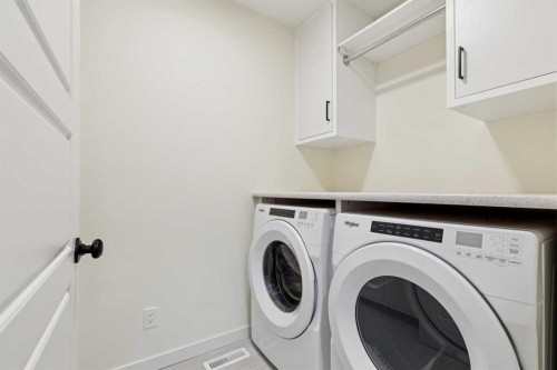 87 Setonstone Landing Se, Calgary, AB - Indoor Photo Showing Laundry Room