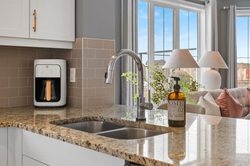 178 Windridge Road Sw, Airdrie, AB - Indoor Photo Showing Kitchen With Double Sink