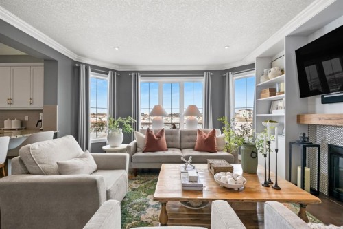 178 Windridge Road Sw, Airdrie, AB - Indoor Photo Showing Living Room With Fireplace