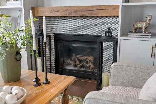 178 Windridge Road Sw, Airdrie, AB - Indoor Photo Showing Living Room With Fireplace