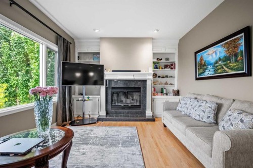 136 Patrick View Sw, Calgary, AB - Indoor Photo Showing Living Room With Fireplace