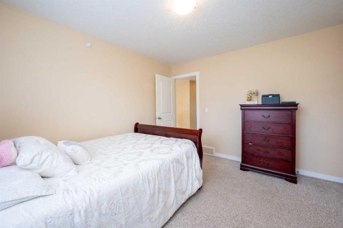 60 Covecreek Mews Ne, Calgary, AB - Indoor Photo Showing Bedroom