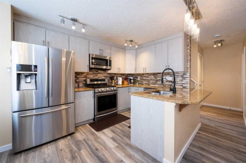 60 Covecreek Mews Ne, Calgary, AB - Indoor Photo Showing Kitchen With Upgraded Kitchen