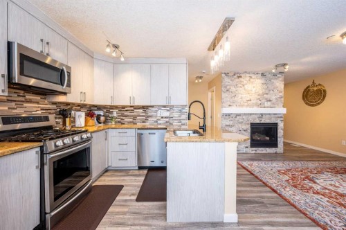 60 Covecreek Mews Ne, Calgary, AB - Indoor Photo Showing Kitchen With Upgraded Kitchen