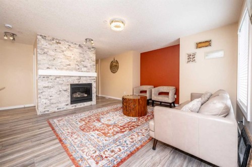 60 Covecreek Mews Ne, Calgary, AB - Indoor Photo Showing Living Room With Fireplace