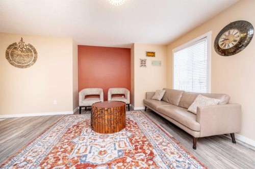 60 Covecreek Mews Ne, Calgary, AB - Indoor Photo Showing Living Room