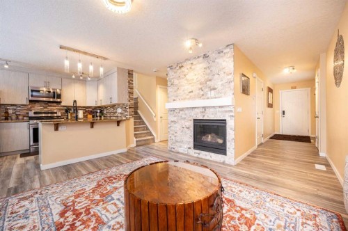 60 Covecreek Mews Ne, Calgary, AB - Indoor With Fireplace