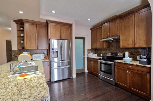 18 Redstone Manor Ne, Calgary, AB - Indoor Photo Showing Kitchen With Double Sink