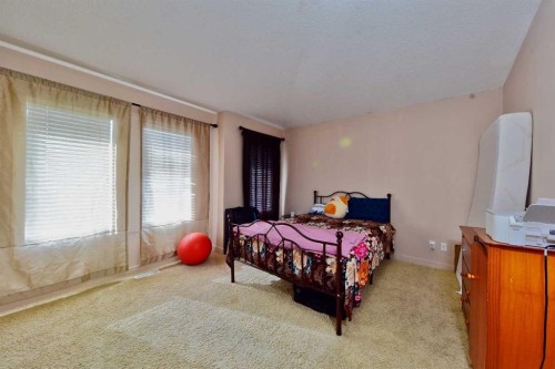 18 Redstone Manor Ne, Calgary, AB - Indoor Photo Showing Bedroom