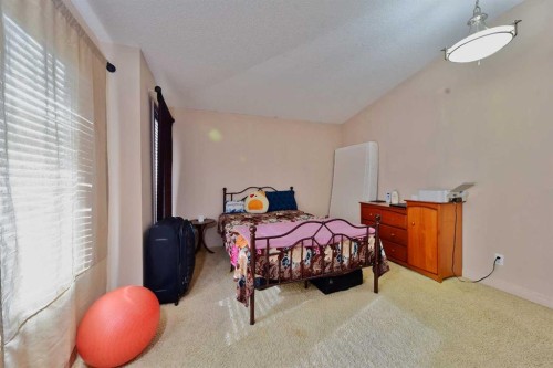 18 Redstone Manor Ne, Calgary, AB - Indoor Photo Showing Bedroom