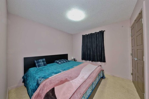 18 Redstone Manor Ne, Calgary, AB - Indoor Photo Showing Bedroom
