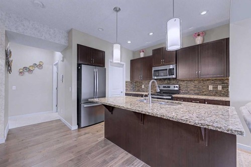 80 Chaparral Valley Crescent Se, Calgary, AB - Indoor Photo Showing Kitchen With Stainless Steel Kitchen With Double Sink With Upgraded Kitchen