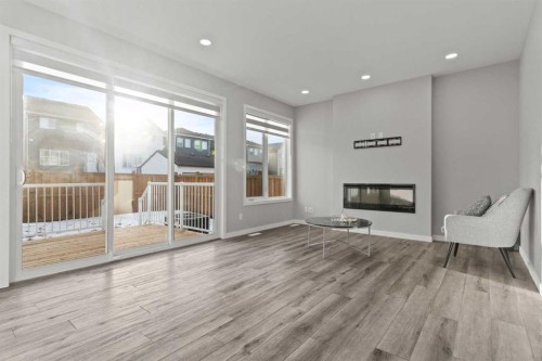 109 Mallard Grove Se, Calgary, AB - Indoor Photo Showing Other Room With Fireplace