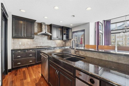 224 Everbrook Way Sw, Calgary, AB - Indoor Photo Showing Kitchen With Stainless Steel Kitchen With Double Sink With Upgraded Kitchen