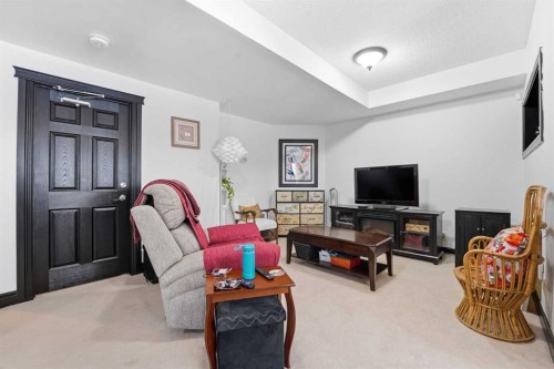 224 Everbrook Way Sw, Calgary, AB - Indoor Photo Showing Living Room