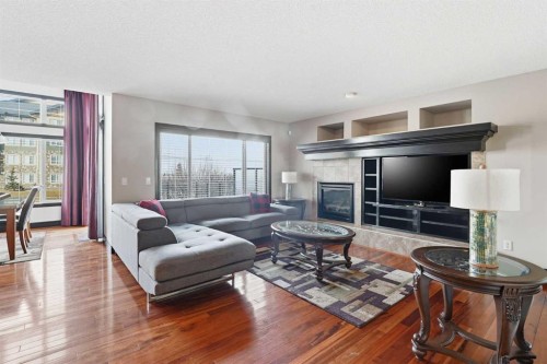 224 Everbrook Way Sw, Calgary, AB - Indoor Photo Showing Living Room With Fireplace
