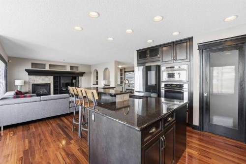 224 Everbrook Way Sw, Calgary, AB - Indoor Photo Showing Kitchen With Fireplace With Upgraded Kitchen