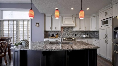 139 Coopers Close Sw, Airdrie, AB - Indoor Photo Showing Kitchen With Double Sink With Upgraded Kitchen