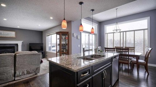 139 Coopers Close Sw, Airdrie, AB - Indoor With Fireplace