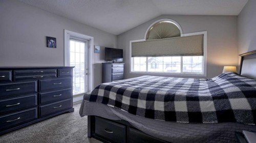 139 Coopers Close Sw, Airdrie, AB - Indoor Photo Showing Bedroom