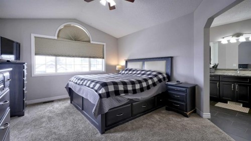 139 Coopers Close Sw, Airdrie, AB - Indoor Photo Showing Bedroom