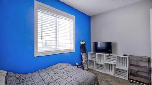 139 Coopers Close Sw, Airdrie, AB - Indoor Photo Showing Bedroom