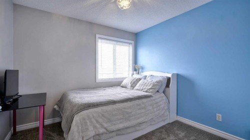 139 Coopers Close Sw, Airdrie, AB - Indoor Photo Showing Bedroom