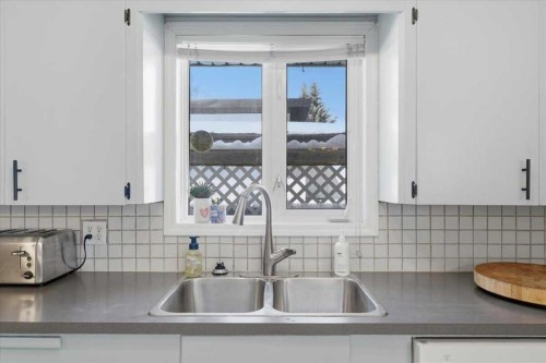 140 Waterloo Drive Sw, Calgary, AB - Indoor Photo Showing Kitchen With Double Sink