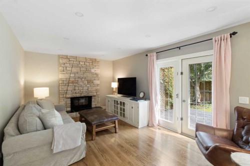 152 Lake Mead Crescent Se, Calgary, AB - Indoor Photo Showing Living Room With Fireplace
