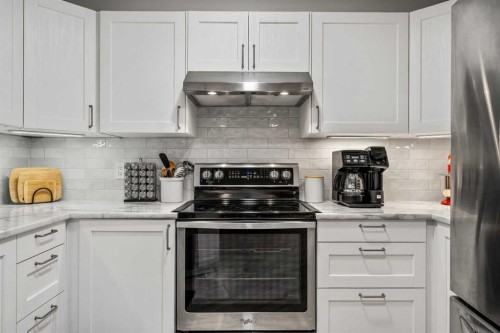 2111 Millrise Point Sw, Calgary, AB - Indoor Photo Showing Kitchen With Stainless Steel Kitchen With Upgraded Kitchen