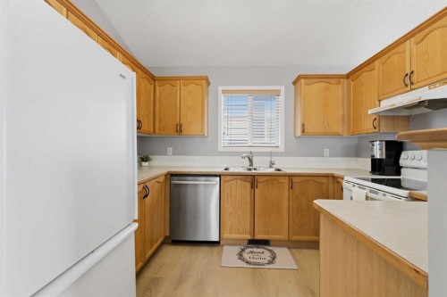 77 Bridleglen Road Sw, Calgary, AB - Indoor Photo Showing Kitchen With Double Sink