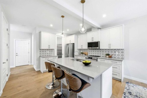 316 Precedence Hill, Cochrane, AB - Indoor Photo Showing Kitchen With Stainless Steel Kitchen With Upgraded Kitchen