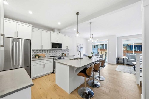 316 Precedence Hill, Cochrane, AB - Indoor Photo Showing Kitchen With Stainless Steel Kitchen With Double Sink With Upgraded Kitchen