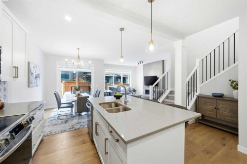 316 Precedence Hill, Cochrane, AB - Indoor Photo Showing Kitchen With Double Sink With Upgraded Kitchen