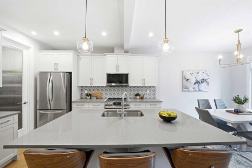 316 Precedence Hill, Cochrane, AB - Indoor Photo Showing Kitchen With Stainless Steel Kitchen With Upgraded Kitchen