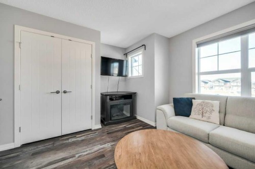 731-101 Sunset Drive, Cochrane, AB - Indoor Photo Showing Living Room With Fireplace