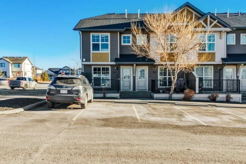 731-101 Sunset Drive, Cochrane, AB - Outdoor With Facade