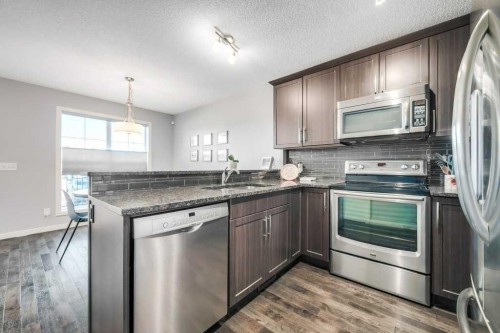 731-101 Sunset Drive, Cochrane, AB - Indoor Photo Showing Kitchen With Stainless Steel Kitchen