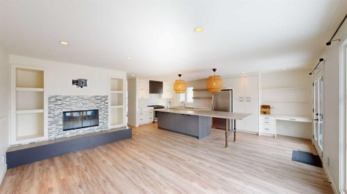 7704 46 Avenue Nw, Calgary, AB - Indoor Photo Showing Other Room With Fireplace